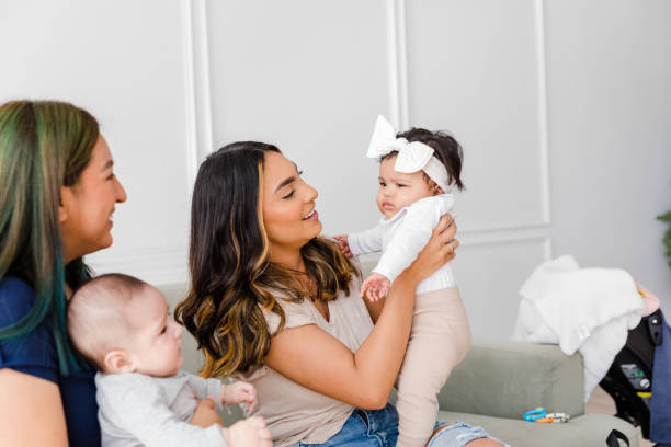 istock Young moms smile at cute, grumpy baby girl 1467976196