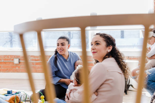 istock Meeting for support group, young mom looks at unseen person 1467976214