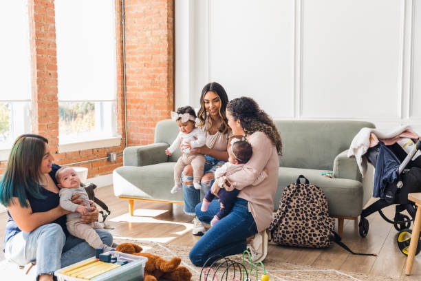 istock Before group therapy, young moms and babies talk together 1467976230