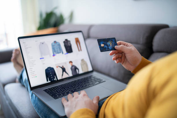 istock Man shopping online via laptop. 1467976942