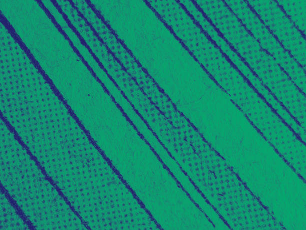 istock Macro view of the dot printing pattern on an old comic book page with abstract green blue color effect 1467976974