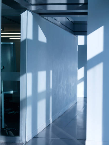 istock Corridor in office building with big windows passing daylight 1467981175