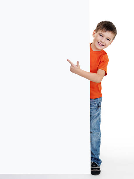 istock little boy pointing on the blank poster 146798134