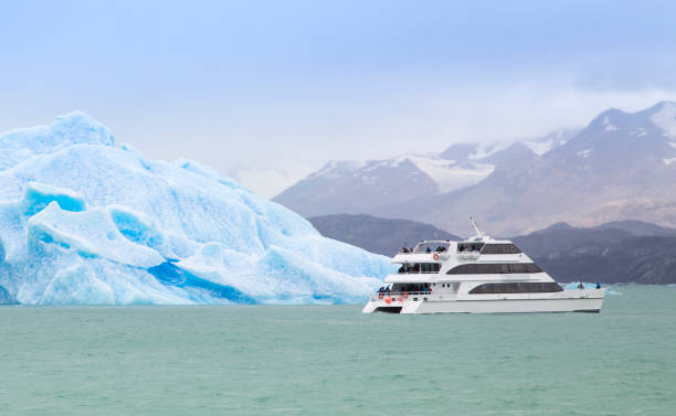 istock Boat passing iceberg in Patagonian waters 1467986992