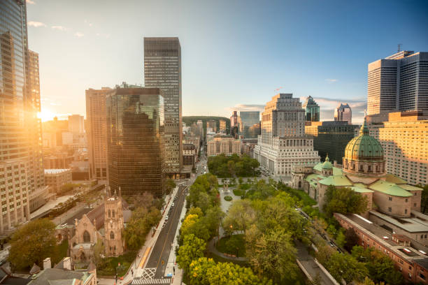 Downtown city skyline daytime view of Montreal Canada Montreal Quebec Canada downtown city skyline view overlooking Dorchester Square public park montreal stock pictures, royalty-free photos & images