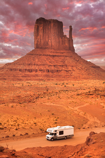 Recreational Vehicle camper motor home drives the road into the Monument Valley Navajo Tribal Park in Arizona USA