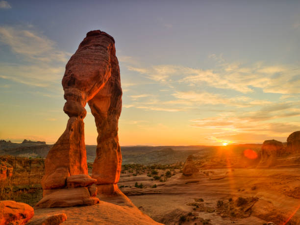 Delicate arch rock formation at sunset Southwest USA red rock landscape in Arches National Park near Moab Utah delicate arch stock pictures, royalty-free photos & images