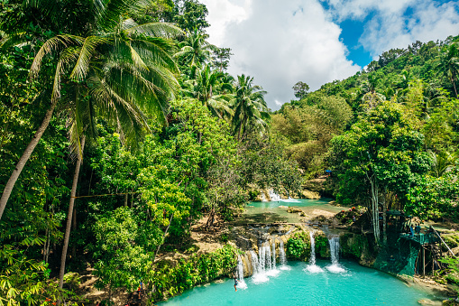 Beautiful and picturesque waterfalls Cambugahay Falls, Siquijor, The Philippines