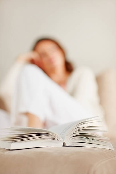 istock Open book with woman in the background 146798948