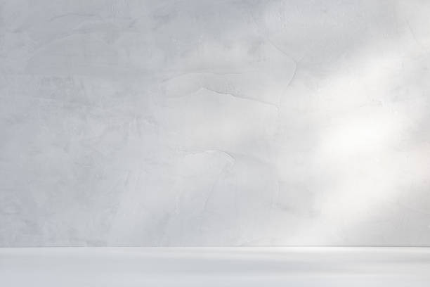 istock Sunlit concrete countertop and wall with natural light 1467989741
