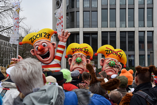 's Hertogenbosch, the Netherlands - March 7, 2011: People dressed in costumes in the annual Carnival parade in aEs Hertogenbosch (more common: Den Bosch) in the province North Brabant. Carnival is a Catholic holiday for celebrating the days before Lent. In the Netherlands Carnival is most celebrated in the southern provinces North Brabant and Limburg. On the side of street a crowd is watching the parade.