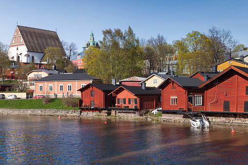 Porvoo, Finland - May 7, 2016: Street view of the old town of Porvoo on a summer day. Red wooden barns are on a river coast