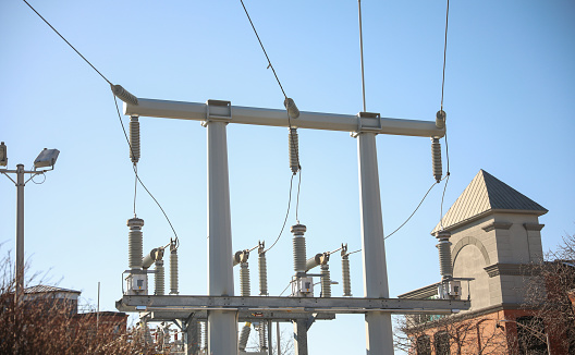 Electrical cables and power station lines for electricity in the blue sky