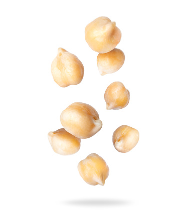 Chickpeas close up in the air isolated on white background