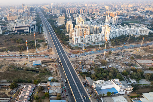 aerial drone still shot showing busy sohna elevated highway toll road with traffic stuck at interesction due to road construction of bridge or underpass India