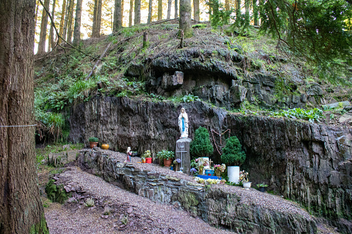 Holy wells are a unique aspect of Irish religious and cultural heritage. These are natural springs or wells that are considered sacred by the local communities. They are often associated with a particular saint, who is said to have blessed the well and given it healing properties. People visit these wells for various reasons, including seeking cures for ailments, offering prayers and devotions, or simply for the sense of peace and contemplation that the site offers.

In Ireland, there are over 3,000 recorded holy wells, each with their own unique history and folklore. Some of the most famous and revered wells include St. Brigid's Well in Kildare, St. Patrick's Well in Lough Derg, and Tobernalt Holy Well in Mayo.

Many holy wells are located in remote and rural areas, and they are often surrounded by ancient trees and stones. The wells are often marked by a simple stone or wooden structure, and they may be decorated with offerings such as ribbons, flowers, or religious statues.

The tradition of visiting holy wells is still very much alive in Ireland today, and many people continue to visit these sacred sites for prayer and contemplation. The practice of visiting holy wells is seen as an important way of maintaining a connection to the ancient traditions of Ireland and the country's rich spiritual heritage.