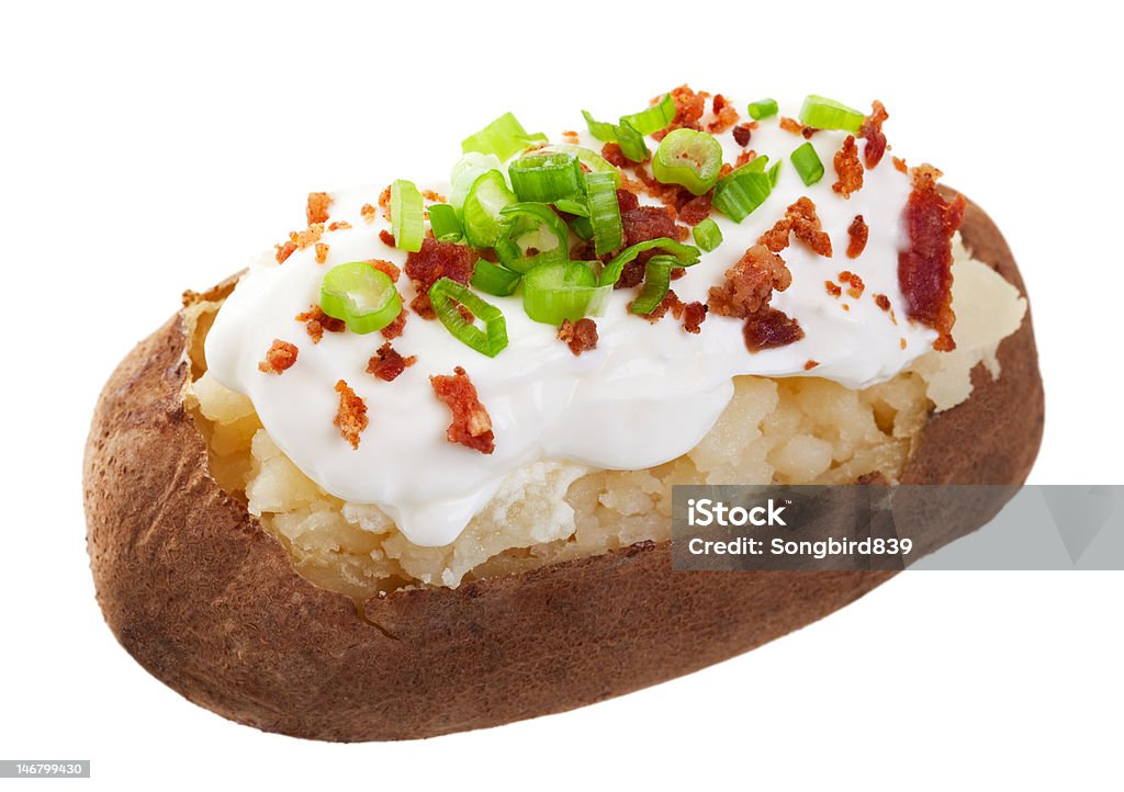 Baked Potato Loaded A baked potato loaded with sour cream, bacon bits, and chives.  Shot on white background. Baked Potato Stock Photo