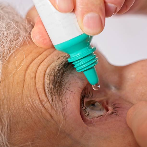 istock Close up eye drops dispensed into eye 1467994435