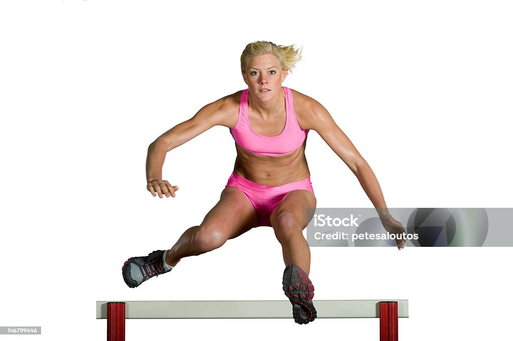Kobieta sportowiec, skoki nad przeszkodą - Zbiór zdjęć royalty-free (Bieg przez płotki)