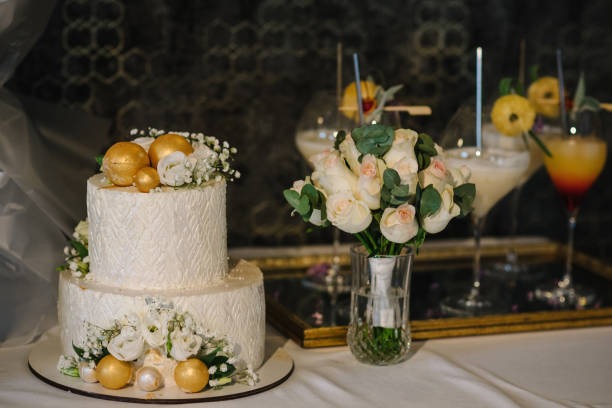 Wedding cake with flowers for a wedding banquet. Delicious reception. Copy space. Celebration party concept. Trendy Cake. Table with a wedding cake.