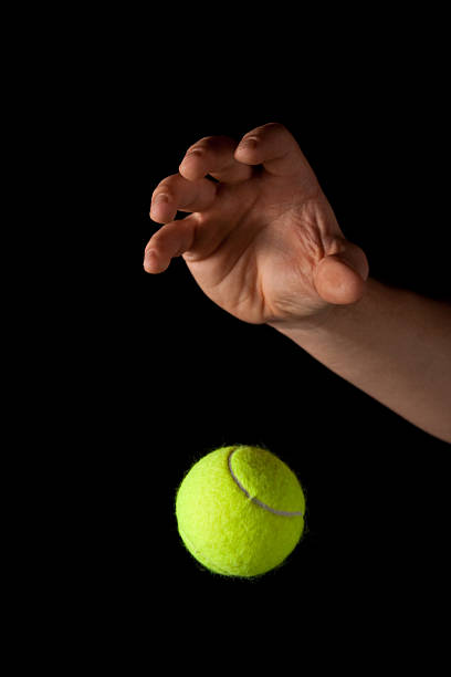 Dropping the Tennis Ball stock photo