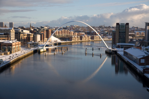 Snow lies on the Newcastle Quayside and on the Millenium Bridge which crosses the River Tyne