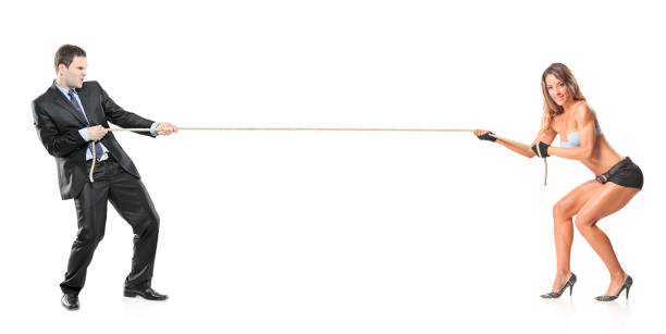 istock Businessman and an attractive woman pulling a rope 146800495