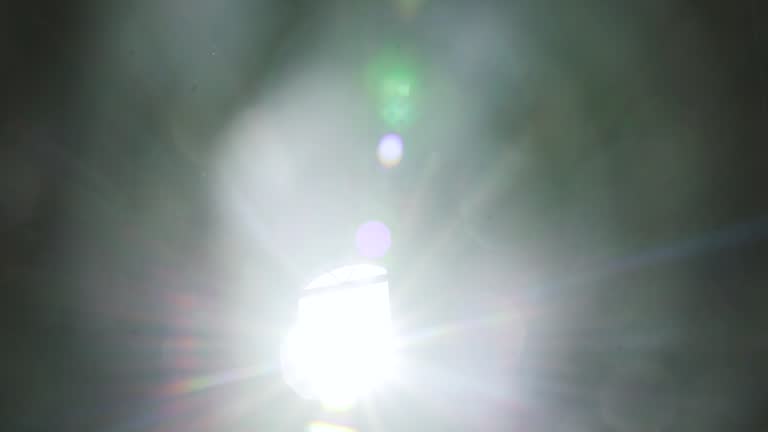 A ray of light through the window in an abandoned temple. Dust cloud