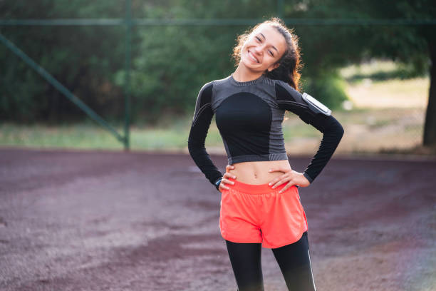 istock Beautiful girl taking a break while exercising outdoors. 1468009113