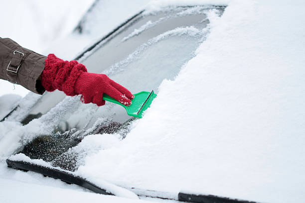 istock Removing Ice and Snow from the Car windshield 146801423