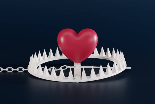 istock Heart over a snare, a trap on a dark background. 1468020953