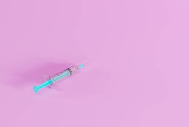 istock Syringe for making injections on a dark background. 1468022144