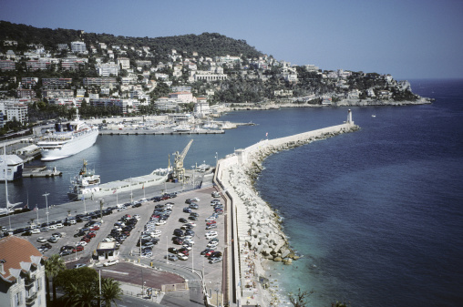 The Harbour wall showing ships berthed at Nice Harbour, France.