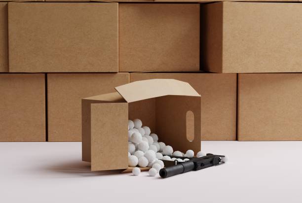 Cardboard boxes in the warehouse and one cardboard box that drops a submachine gun.