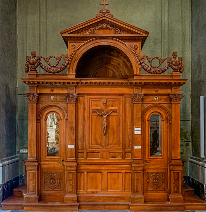 confessional box inside the Basilica sacro cuore, Rome, Italy.