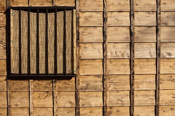 Old look textured wood siding on a building stock photo