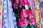 Shiny Colorful Skirts Hanging/Lined Up (Close-Up), Price Tag