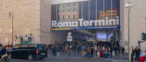 One of the side access passages to the train and metro station in the city center of Rome with numerous passengers in circulation, Italy. Rome Termini stock photo