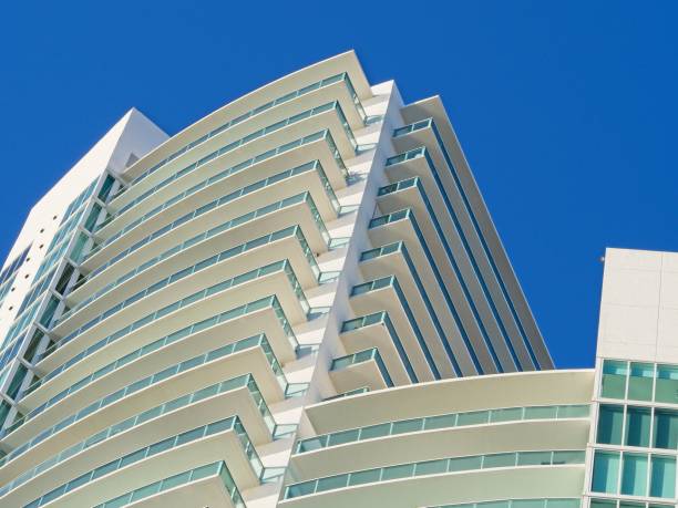 The geometric patterns and design of a high rise condominium building. Multi story apartment living shown in an abstract design. Luxury apartments located in Miami beach with copy space.