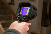 Handheld infrared thermal camera being used