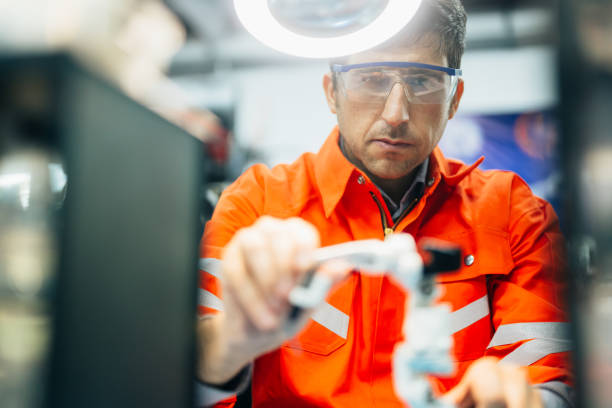 istock Professional technician checking and repairing parts of robotic machine 1468033763