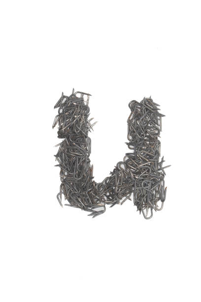 istock artistic isolated lowercase Letter u made from steel staples isolated on a white background write, font, type style, barbed wire staple 1468040135