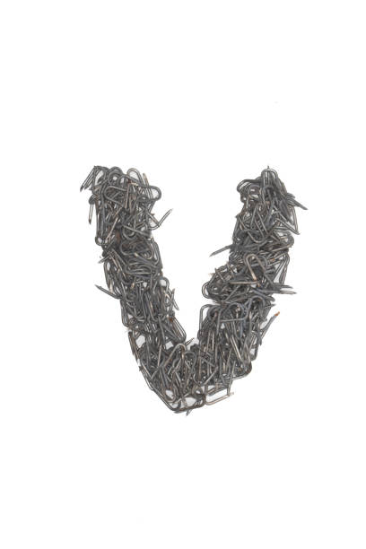 istock artistic isolated lowercase Letter v made from steel staples isolated on a white background write, font, type style, barbed wire staple 1468040137