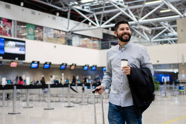 istock Businessman waiting for his flight at airport 1468040840