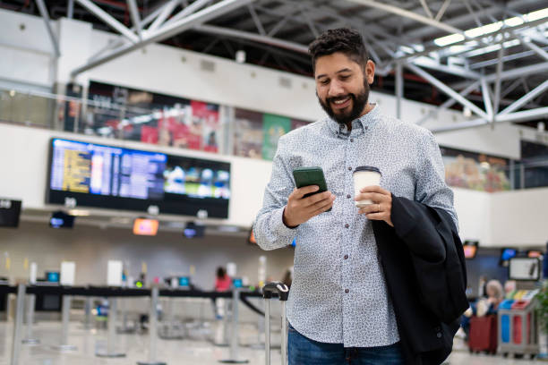 istock Businessman waiting for his flight at airport 1468040845