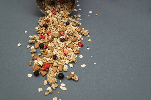 Baked fruit muesli scattered on the table. Homemade granola. Side view