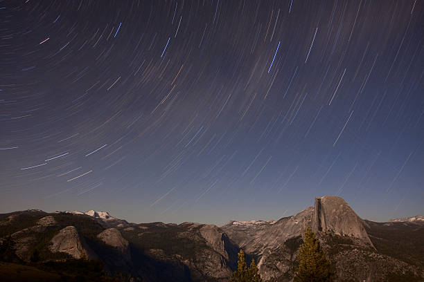 Large Star Trail over Half Dome stock photo