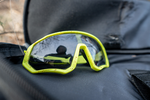 sports sunglasses placed on a spot bag