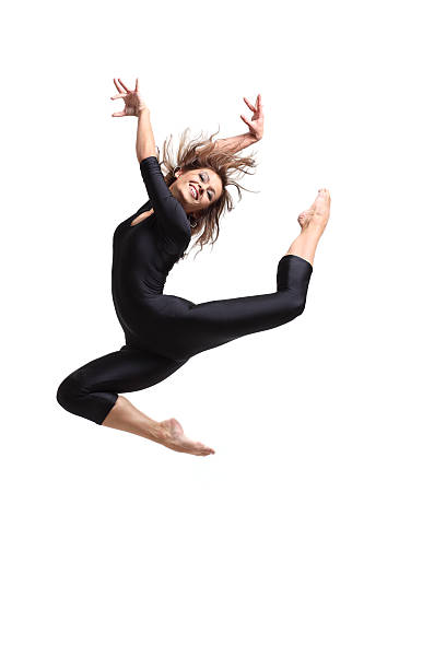 istock Jumping female dancer in a black unitard isolated on white 146805237