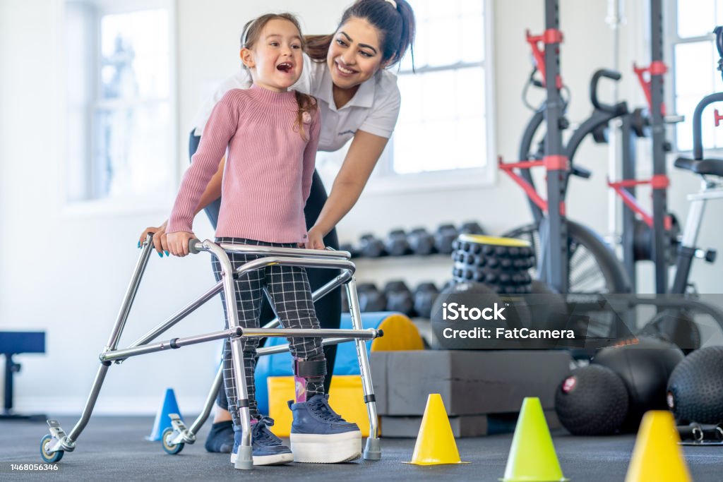 Kids Using Walker Learning To Use A Walker Stock Photo - Download Image Now - Child ...